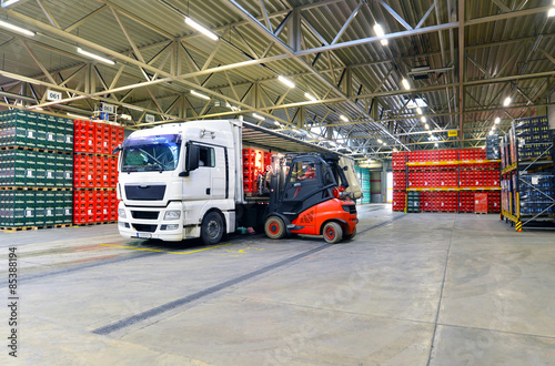 shipping - loading of a truck in a warehouse by forklift
