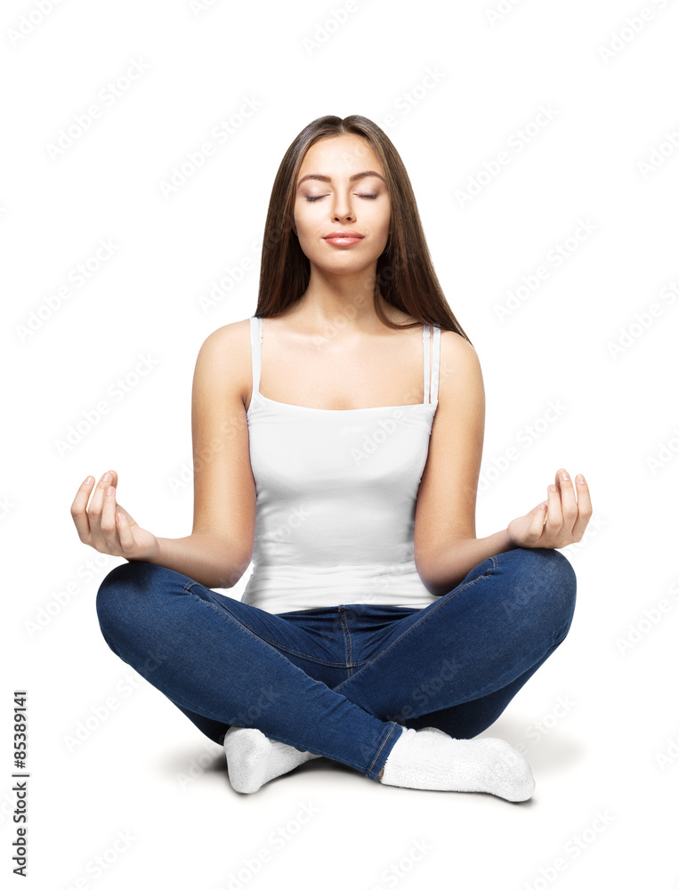 Happy young woman sitting in lotus position Happy young woman sitting in lotus position