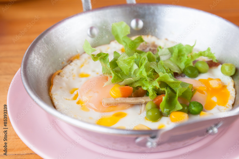 Fried eggs in a pan with vegetables, Fried eggs in a pan with vegetables,
