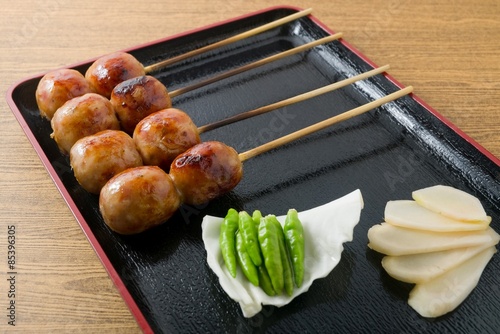 Thai Traditional Grilled Sausages on Wooden Skewer photo