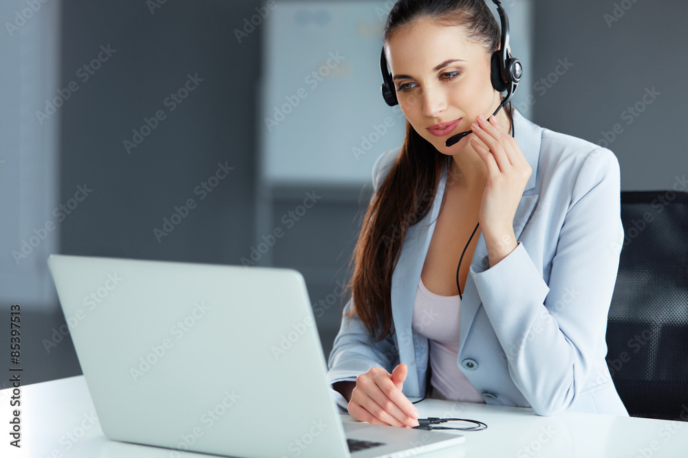 Call Center Operator Sitting Infront of Her Computer Call Center Operator Sitting Infront of Her Computer