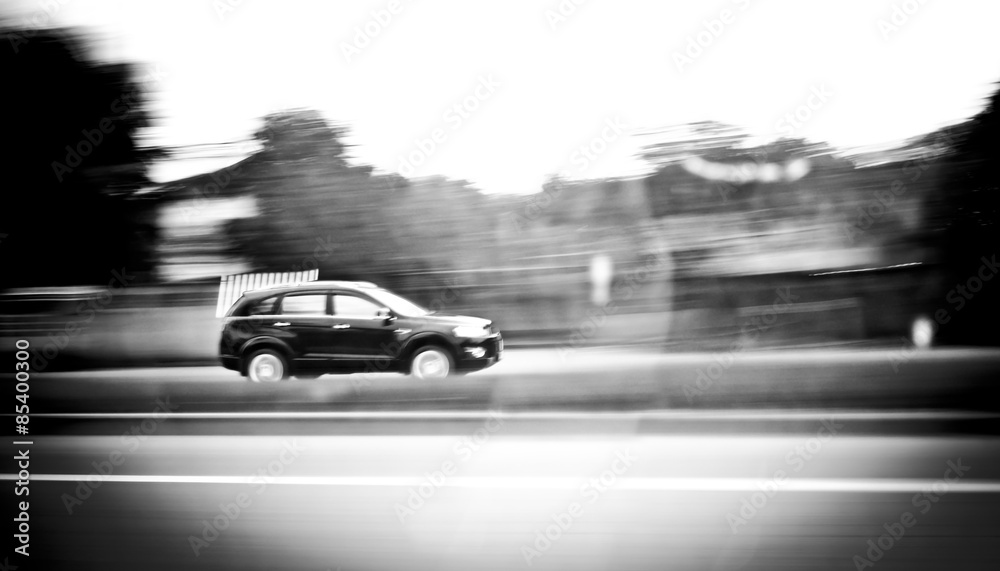 Motion blur background : car running on road ,blurred background