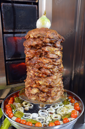 Doner kebab roasted on rotating spit photo