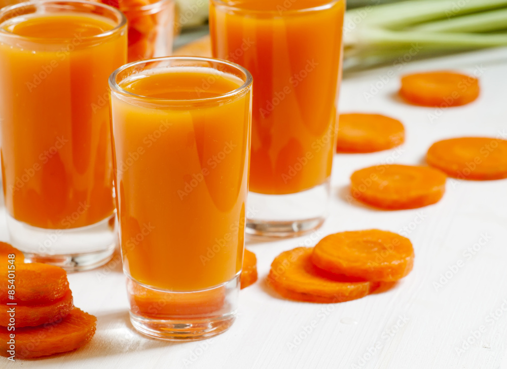 Fresh carrot cocktail glasses, selective focus Fresh carrot cocktail glasses, selective focus