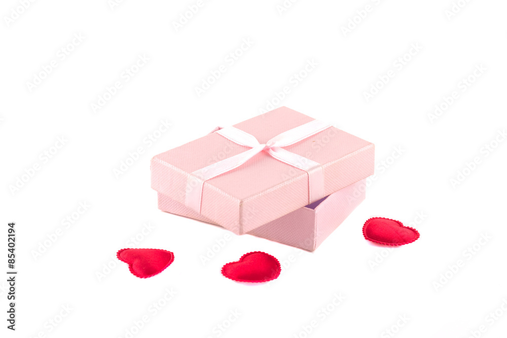 Gift box with a pink ribbon and red hearts Gift box with a pink ribbon and red hearts