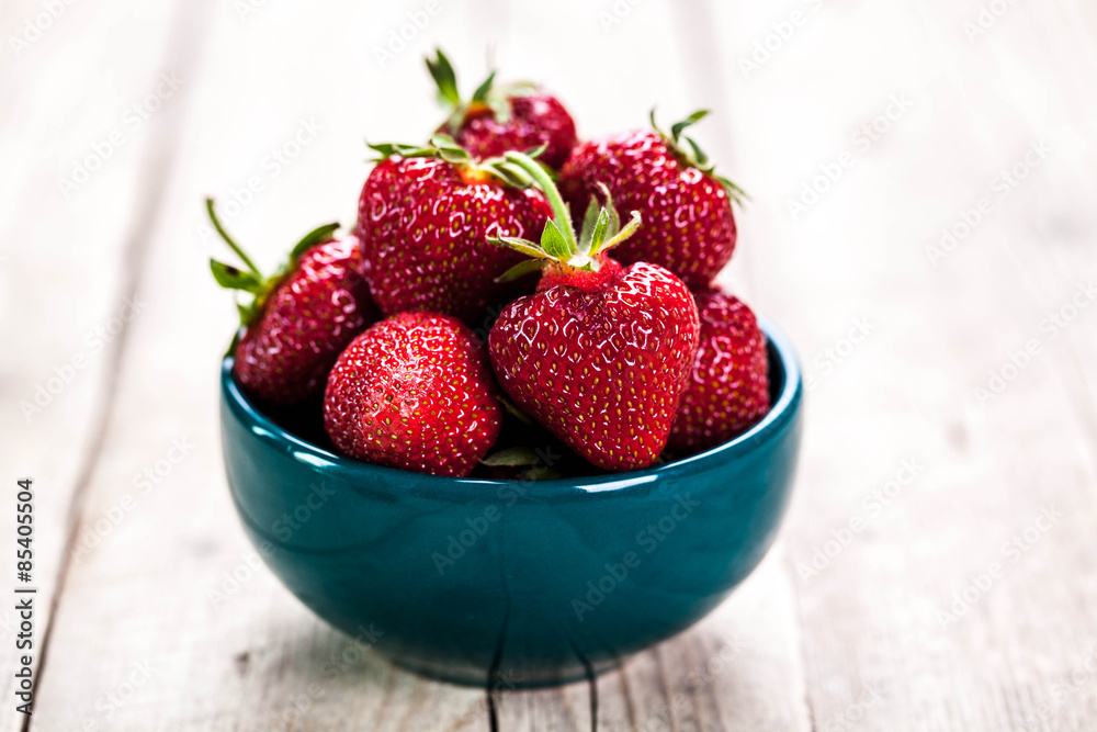 Red strawberries on blue clay plate. fruit Red strawberries on blue clay plate. fruit