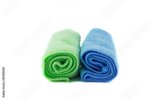 A roll of green and blue towels
