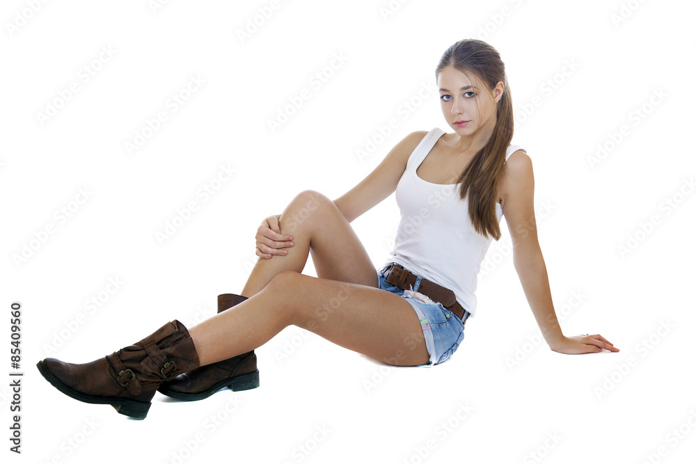 Portrait in full growth the young girl in blue jeans short Portrait in full growth the young girl in blue jeans short