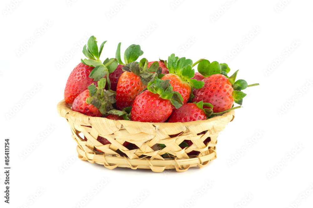 Handful of strawberries in a wicker basket Handful of strawberries in a wicker basket