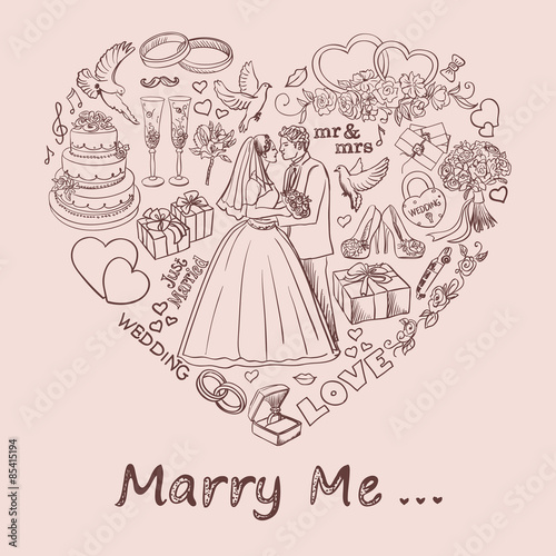 Heart drawn on sand with marry me text