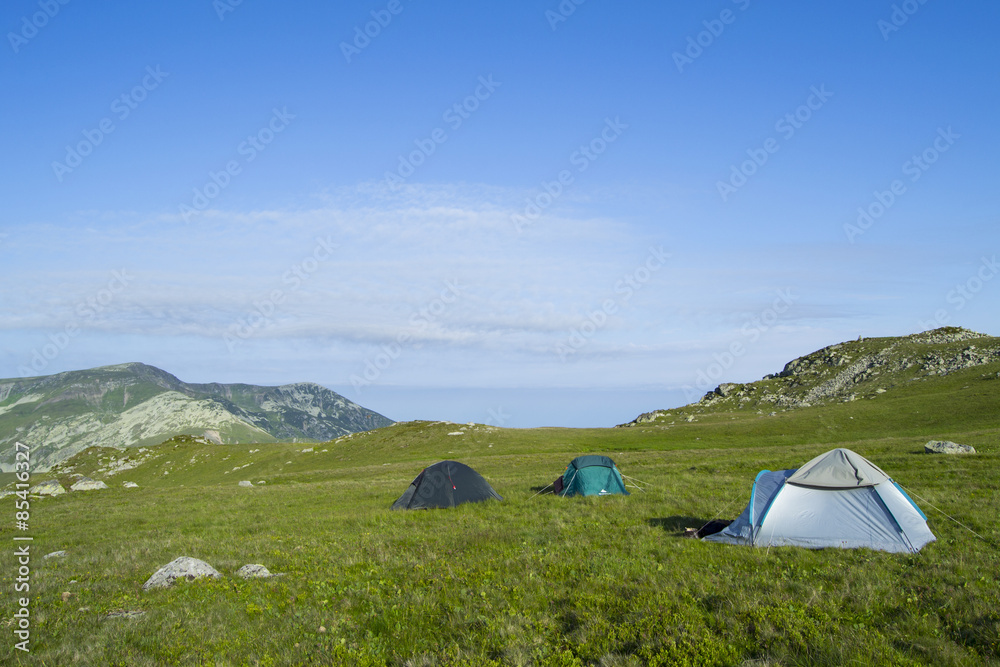 Three tents set up up in the carpathian mountains