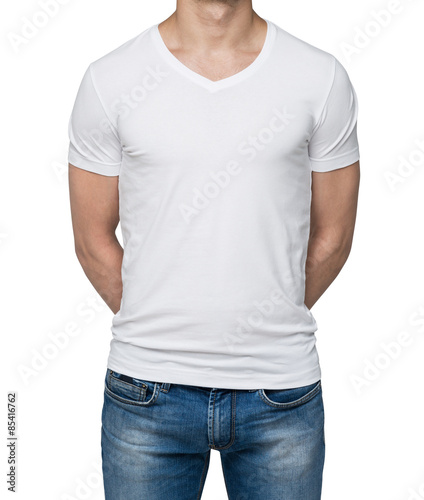 Close up of the body view of the man in a white t-shirt. Hands are crossed behind the back. Isolated on the white background.