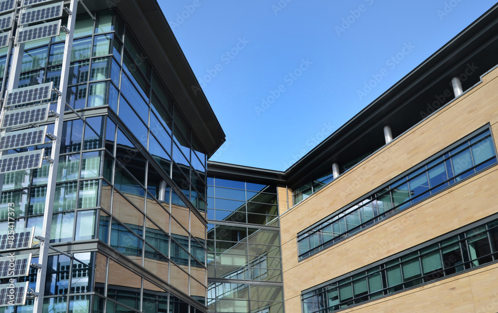 Fototapeta premium Contemporary Glass Office Building on Business Park