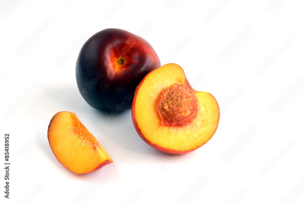 Whole Nectarine and one Sliced Open to Reveal the Stone