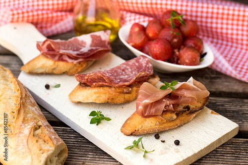 Italian ham dry cured prosciutto on bread toast