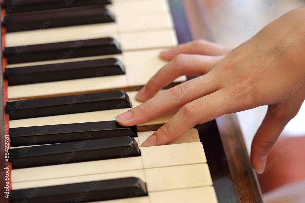 Fototapeta premium hands playing the classic wood piano