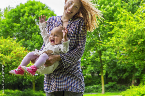 Mother and daughter playing in the park