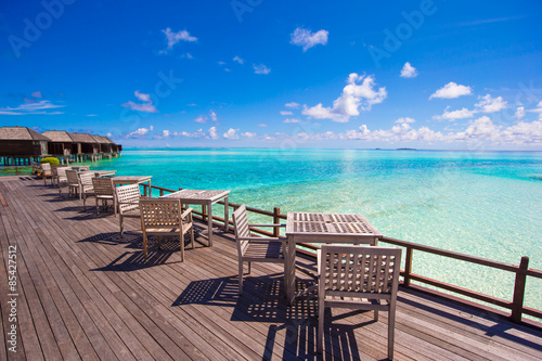 Summer empty outdoor cafe at exotic island on the seashore © travnikovstudio
