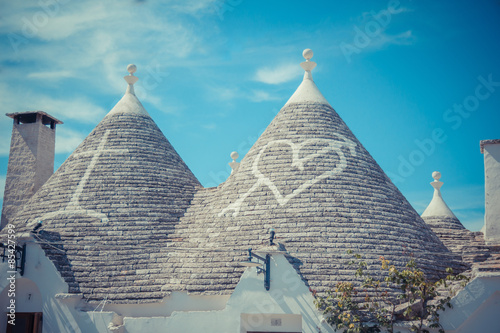 Close up of a conical roofs of a Trulli houses with painted symbols in the southern Italian town of Alberobello  Apulia  Italy