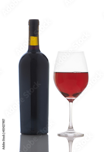 Glass of Red Wine and Bottle