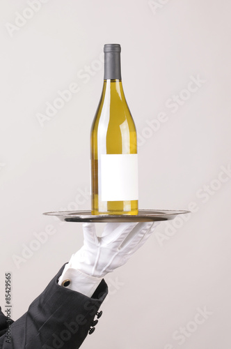 Waiter White Wine Bottle on Tray © Steve Cukrov