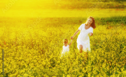 happy family, mother and child l little daughter running  on mea photo