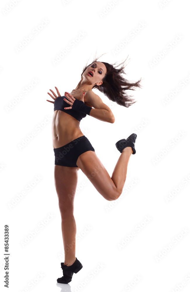 Stylish and young modern style dancer jumping Stylish and young modern style dancer jumping