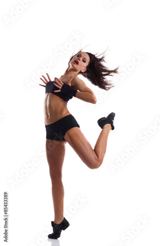 Stylish and young modern style dancer jumping 