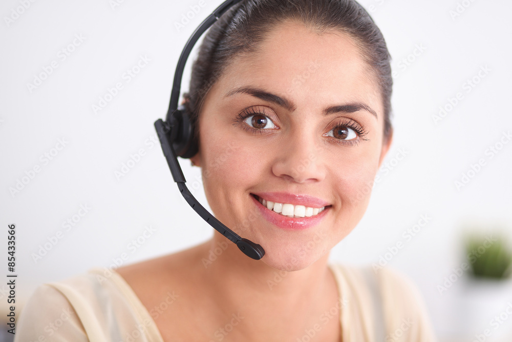 Close-up portrait of a customer service agent sitting at office Close-up portrait of a customer service agent sitting at office