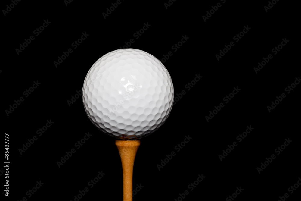 Golf Ball on Tee-Peg on black background Golf Ball on Tee-Peg on black background