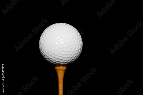 Golf Ball on Tee-Peg on black background
