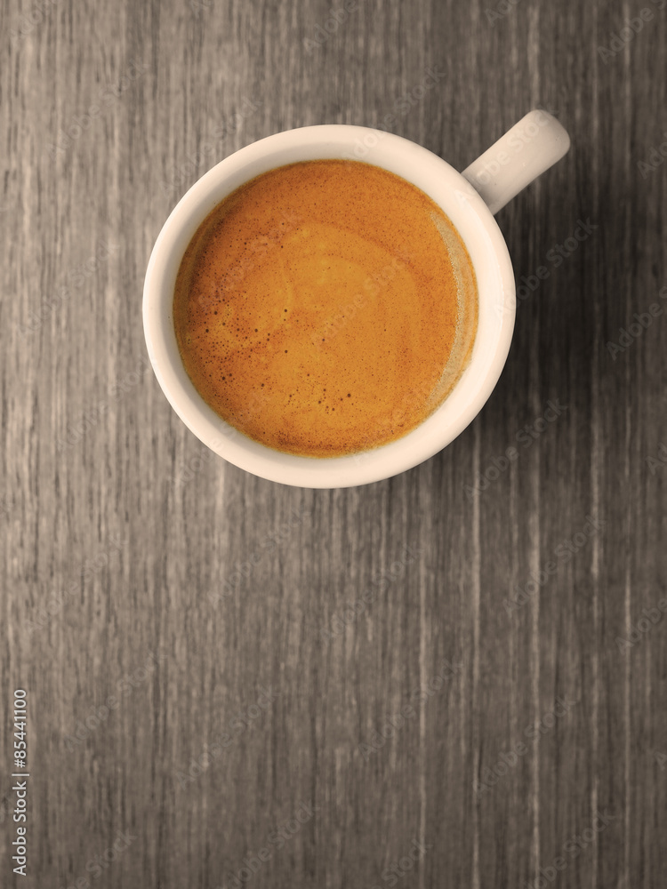 Cup of hot espresso coffee on wooden texture Cup of hot espresso coffee on wooden texture
