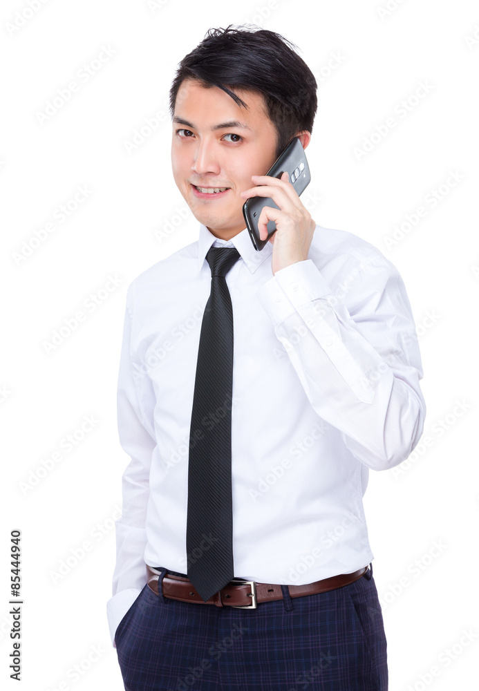 Young businessman talk to cellphone Young businessman talk to cellphone