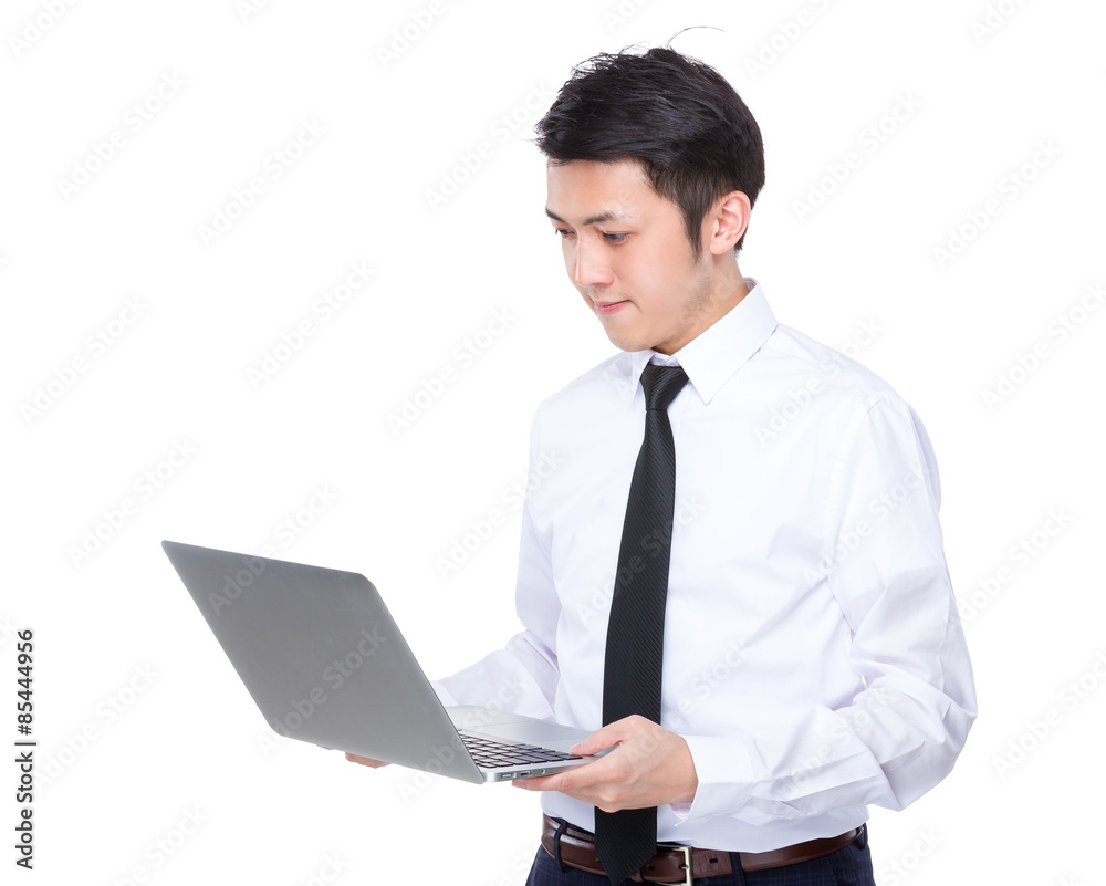 Asian businessman use of the laptop computer Asian businessman use of the laptop computer