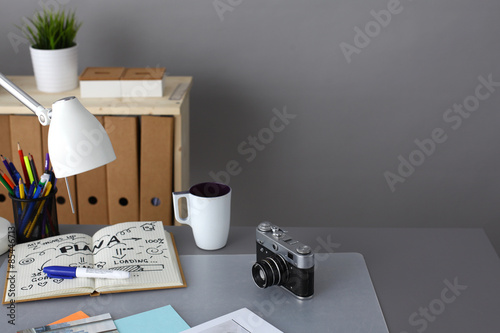 Designers table with camera and tools © lenetsnikolai