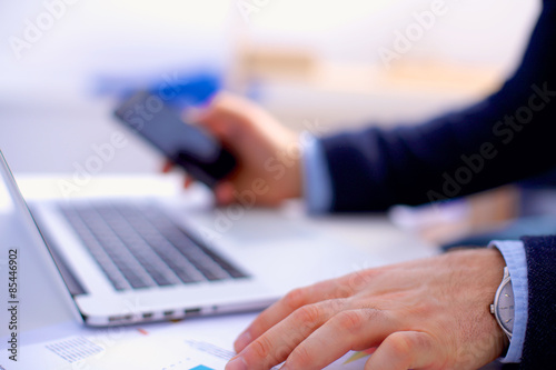 Man's hands typing on laptop. Internet surfing