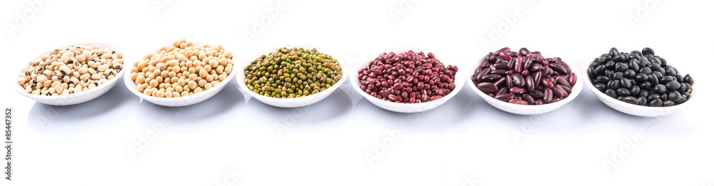 Beans variety in white bowl over white background Beans variety in white bowl over white background