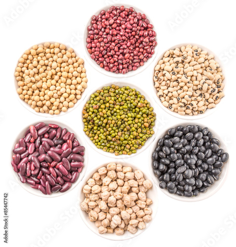 Beans variety in white bowl over white background