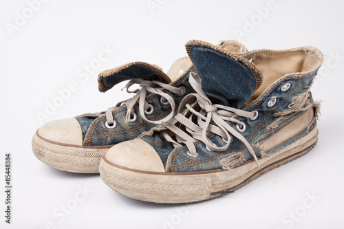 Old & Torn shoes isolated on white background