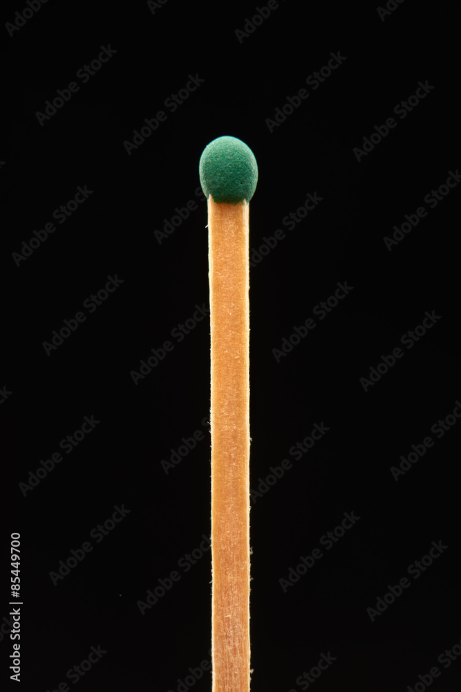 Green match isolated on black background Green match isolated on black background
