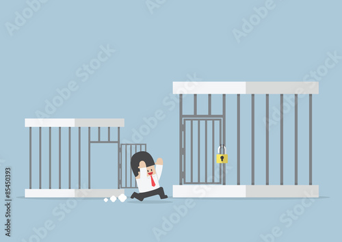 Businessman runing out from small cage to the bigger cage