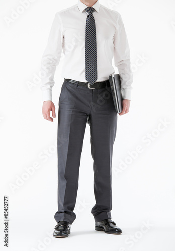 Unrecognizable young businessman holding a laptop