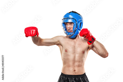 Fighter in sports helmet and gloves