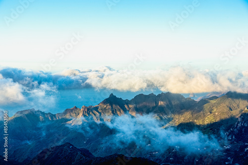 Mountains with white and pink clouds