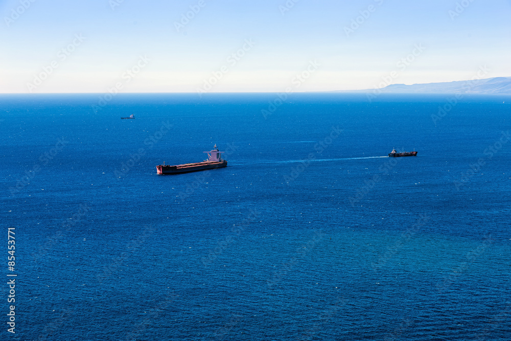 Container cargo ship and vessels in ocean