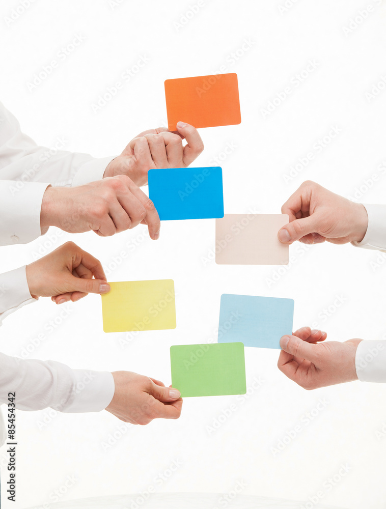 Obraz premium Business people holding colorful cards