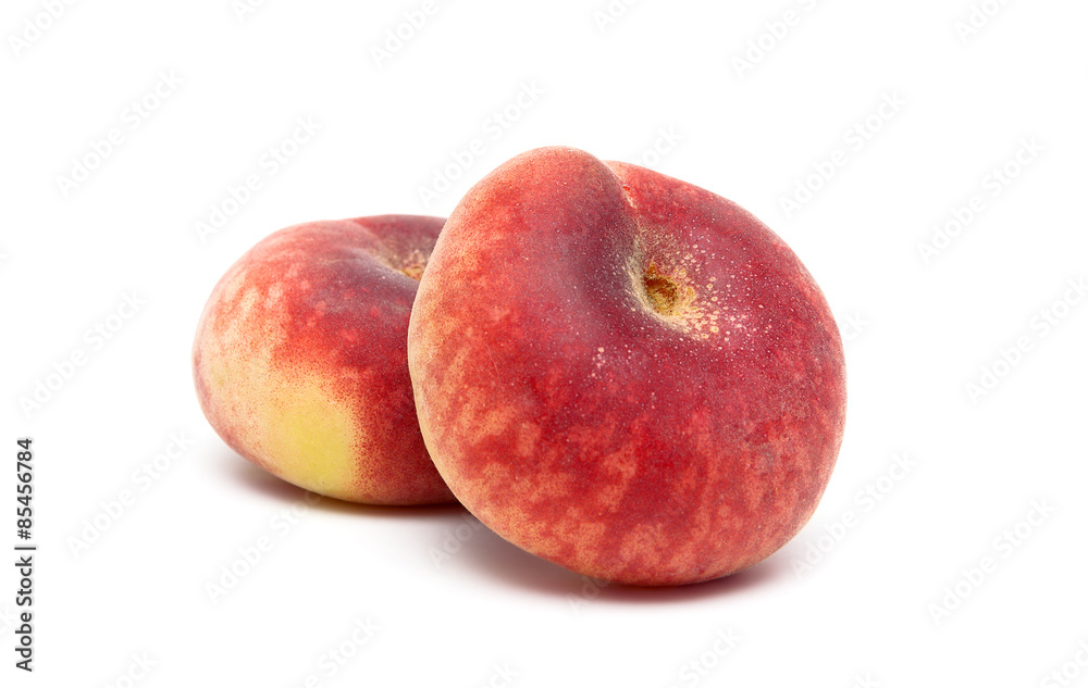 ripe peaches close-up on a white background