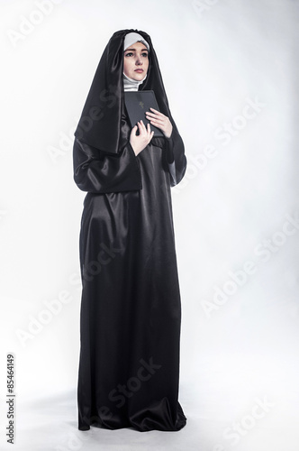 Young nun in religious concept