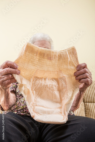 holding diaper (incontinence pad) for adults photo