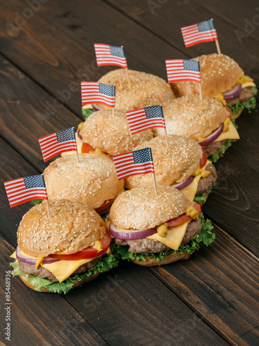 American beef burgers with cheese and USA flags.